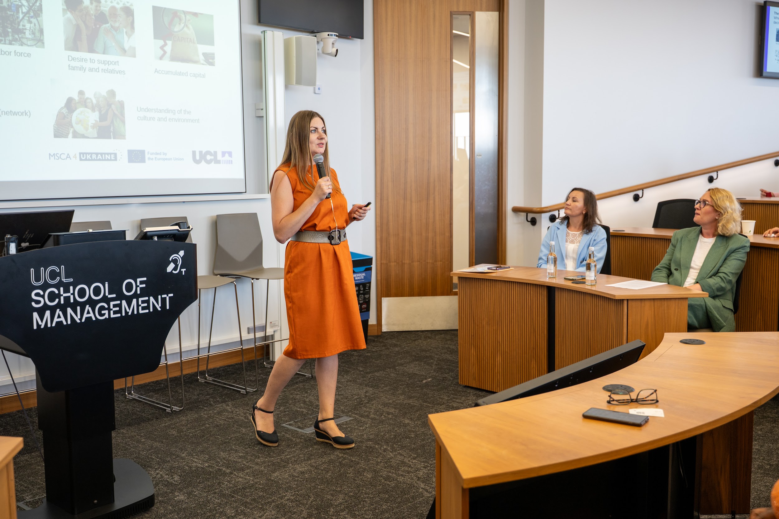 Natalia Hrytsiuk speaking during the panel discussion at UCL School of Management in London.
